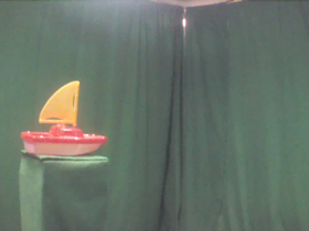 225 Degrees _ Picture 9 _ Red and Yellow Toy Sailboat.png